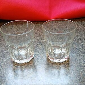 2 Glasses Numbered And An Anka On The Bottoms.